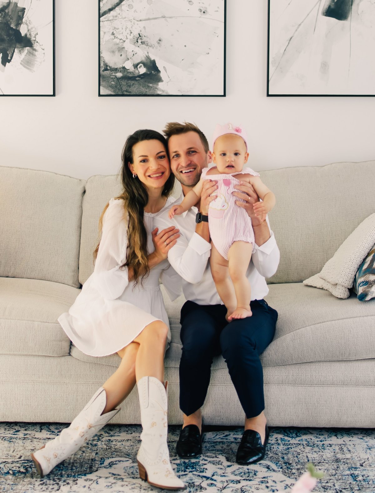 Masha, Grant, and their daughter at home